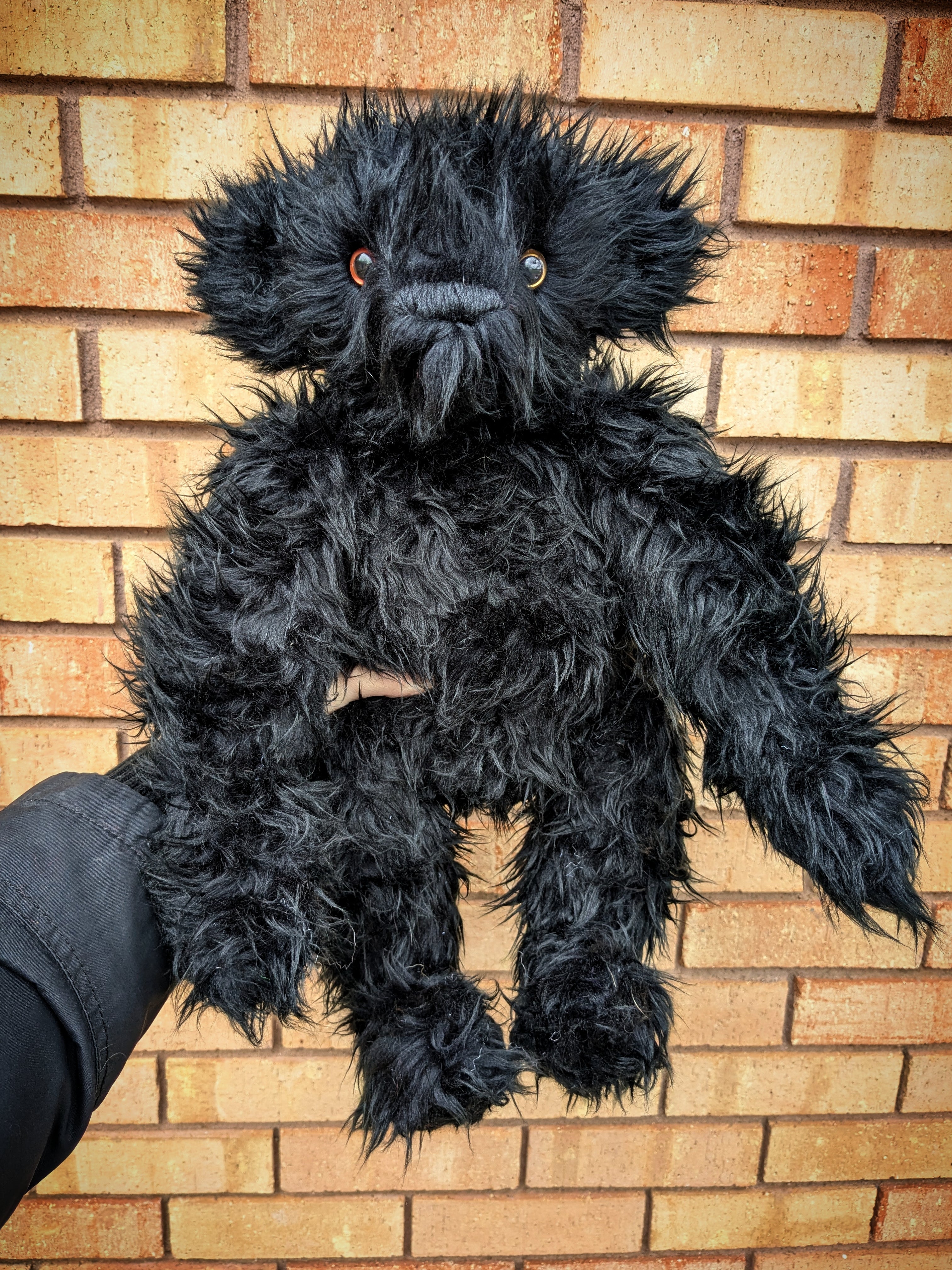 Edward The Short Curly Haired Black Faux Fur Teddy Bear With One Copper And One Gold Eye