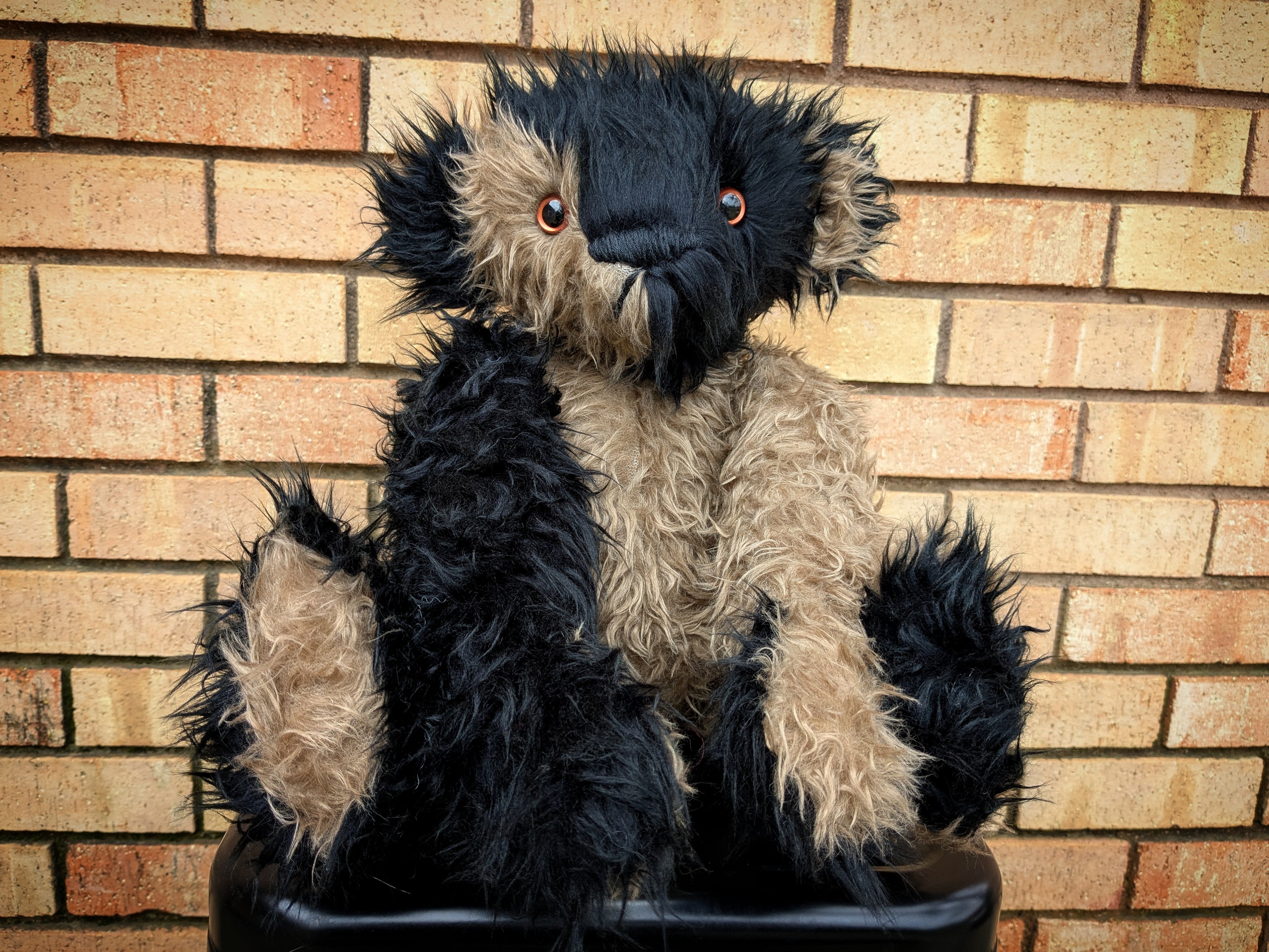 Walter The Short Curly Haired Black And Beige Faux Fur Teddy Bear With Copper Eyes